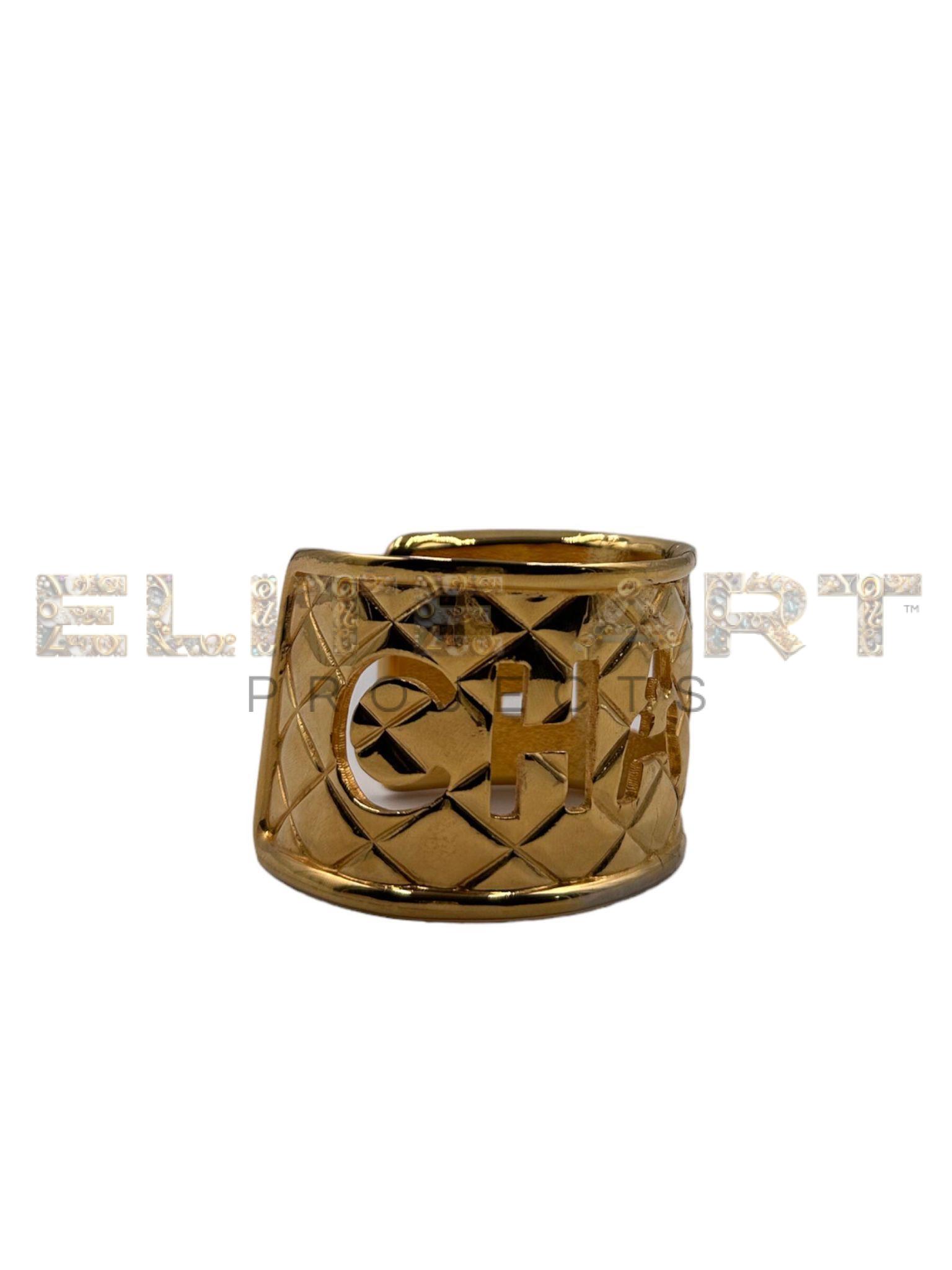 Chanel,vintage,bracelet,bangle,gold-plated metal,embossed quilted pattern,"CHANEL" logo,16.5 cm circumference,adjustable opening